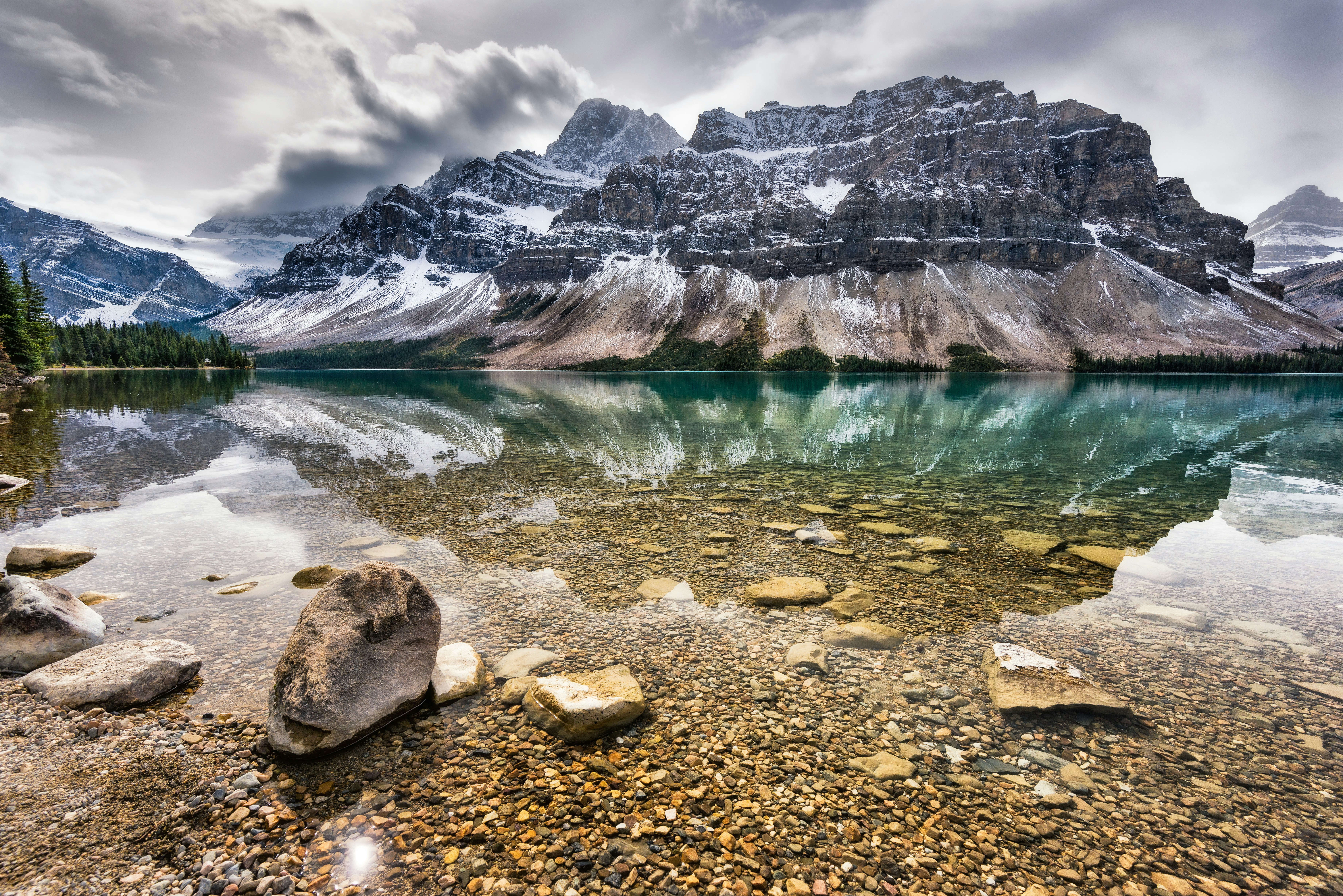 gray rocky shore with blue water